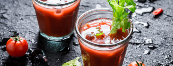 Two glasses of bloody mary cocktail drink.